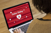 woman computer online dating Sexual Fraud: Should It Be Illegal To Lie On Your Tinder Profile?